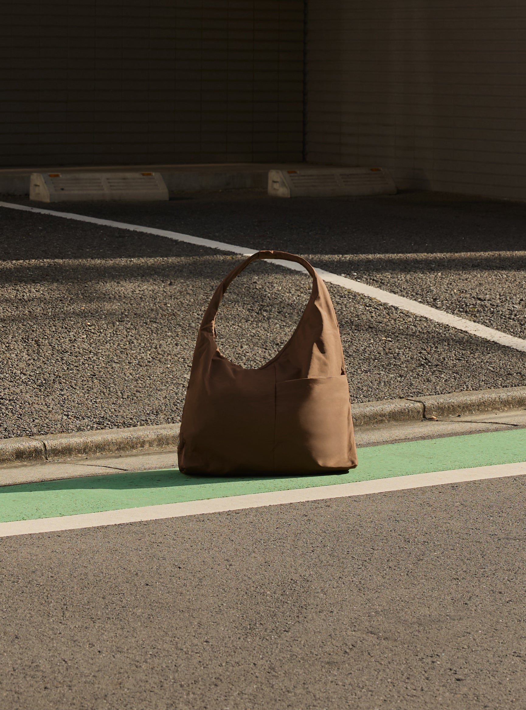The Arc slouchy hobo-style bag in chocolate brown nylon for work and office