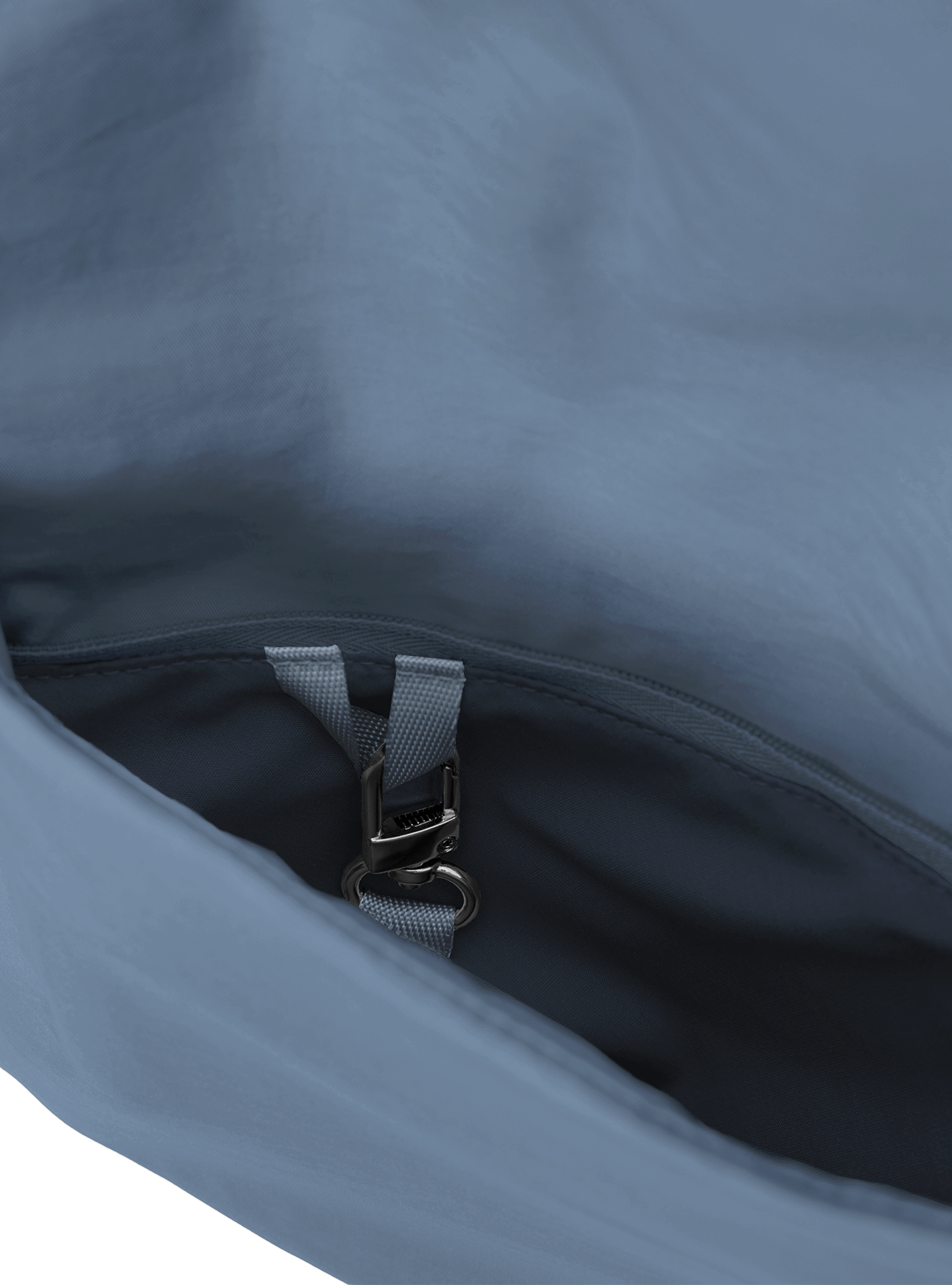 Exterior pocket of the Arc hobo-style bag in grey blue nylon, with concealed snap loop